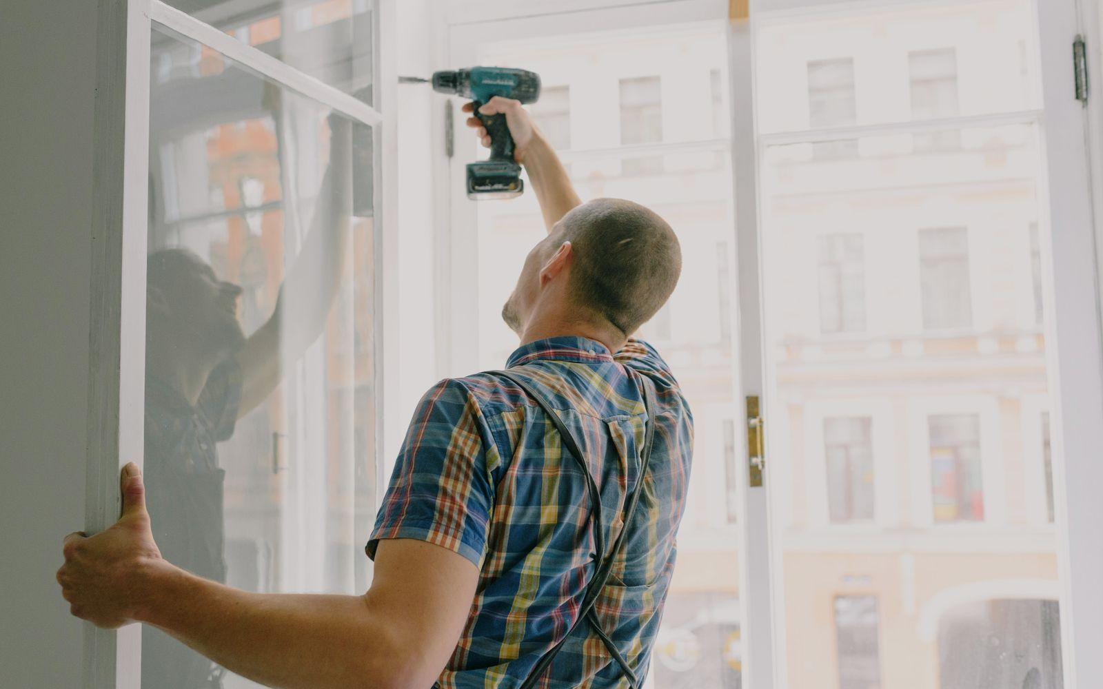 A maintenance technician making a home repair